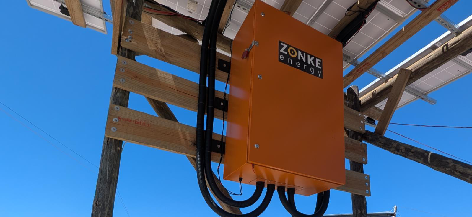 The orange Zonke equipment meter box mounted to a tower strut.